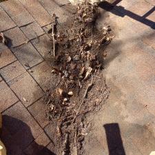 Gutter-Cleaning-in-Simpsonville-South-Carolina-Lots-of-roof-debris 1